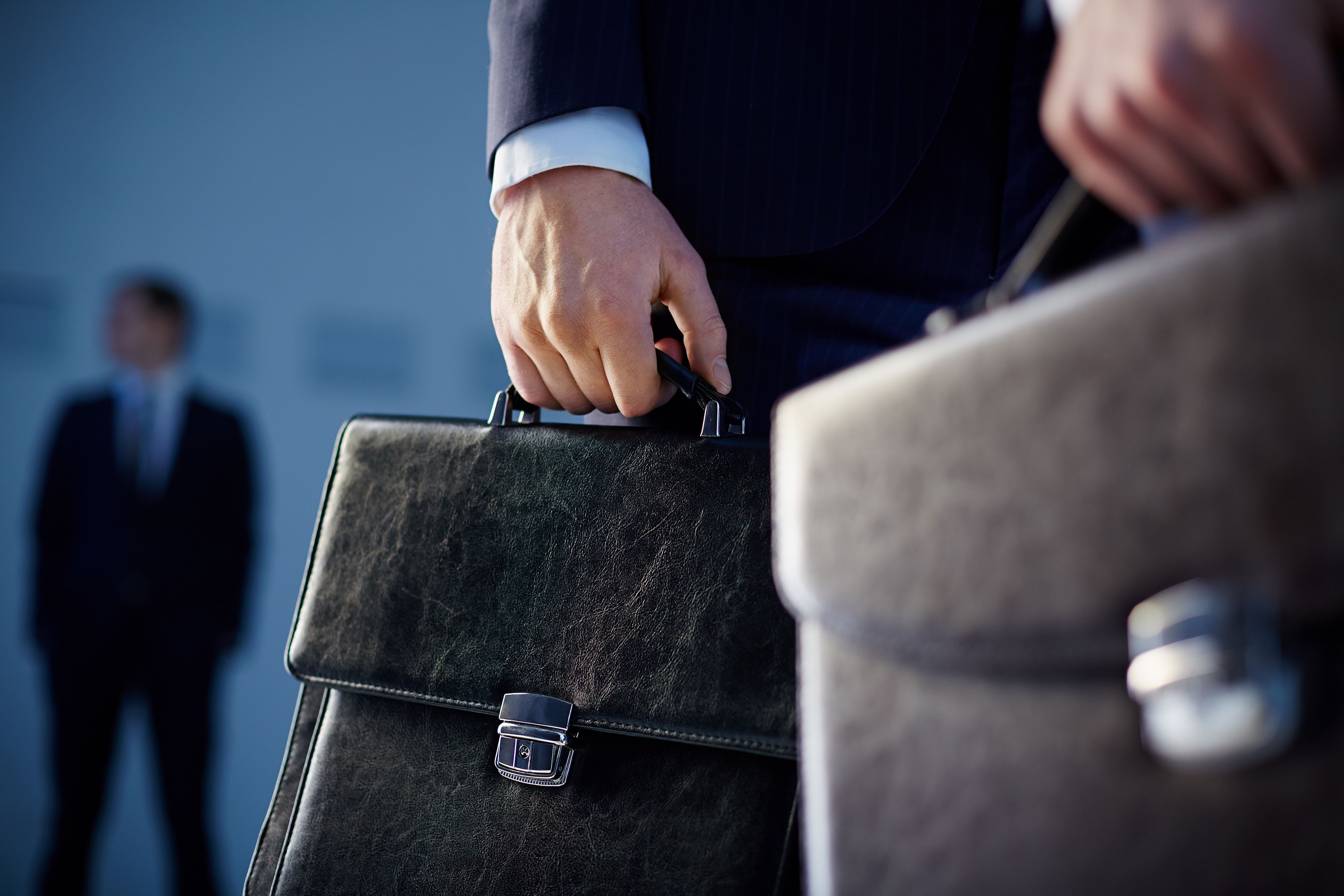 close-up-workers-with-briefcases.jpg